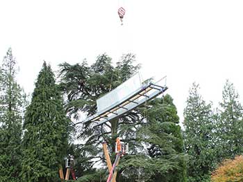 Carefully craning one of the highest sections into place