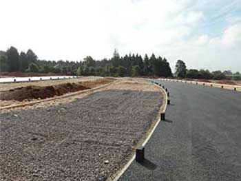 Some of the stone has been laid in the new parking bays.