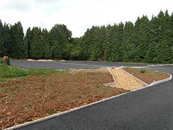 This is the new coach park! It's nearly finished except for white lining and the surface on the footpath.