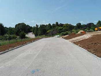 The turning on the right in this photo will be into an overflow car park.  On the left in the distance is the plant centre and its pick up parking.