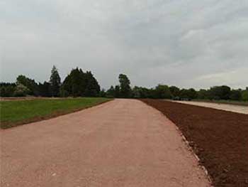 This shows the nearly completed feeder road for the new overflow car parking