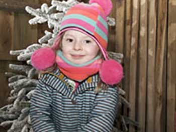 A child enjoying crafts at Enchanted Christmas