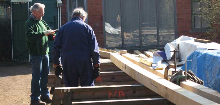 Brain Carruthers and Michael Goom inspecting a roof plate Brain Carruthers and Michael Goom inspecting a roof plate