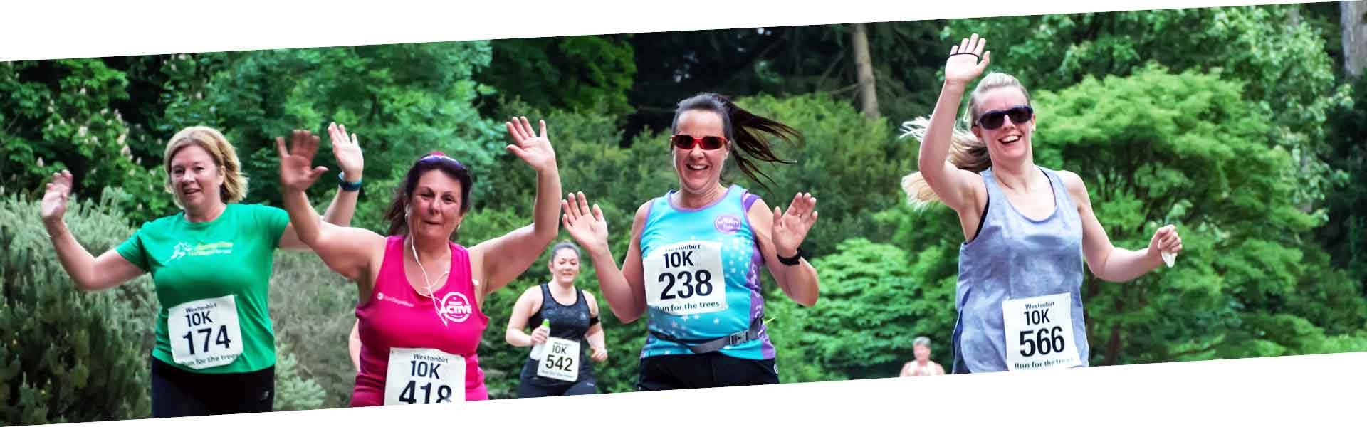 A group of runners waving