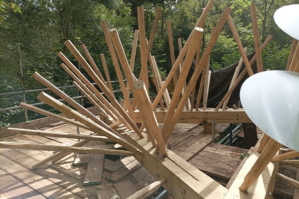 A wooden structure with numerous wooden sticks arranged in a pattern.